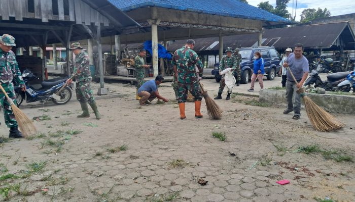 Hangatnya Kebersamaan di Pekan Merek Raya, Satgas TMMD Ke 127 dan Warga Gotong Royong Bersihkan Fasilitas Umum
